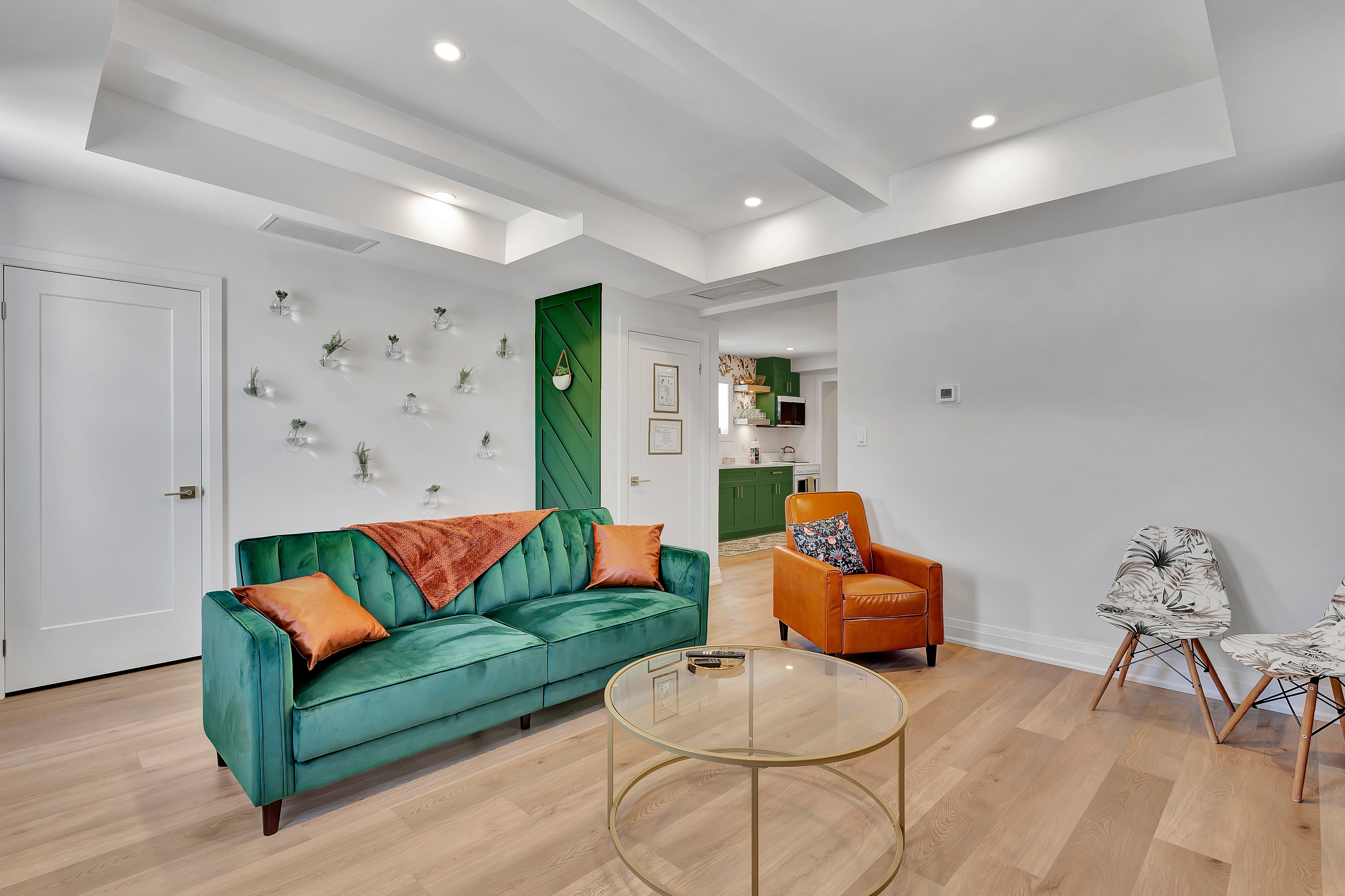 Saint Patrick suite living room with botanical plant wall